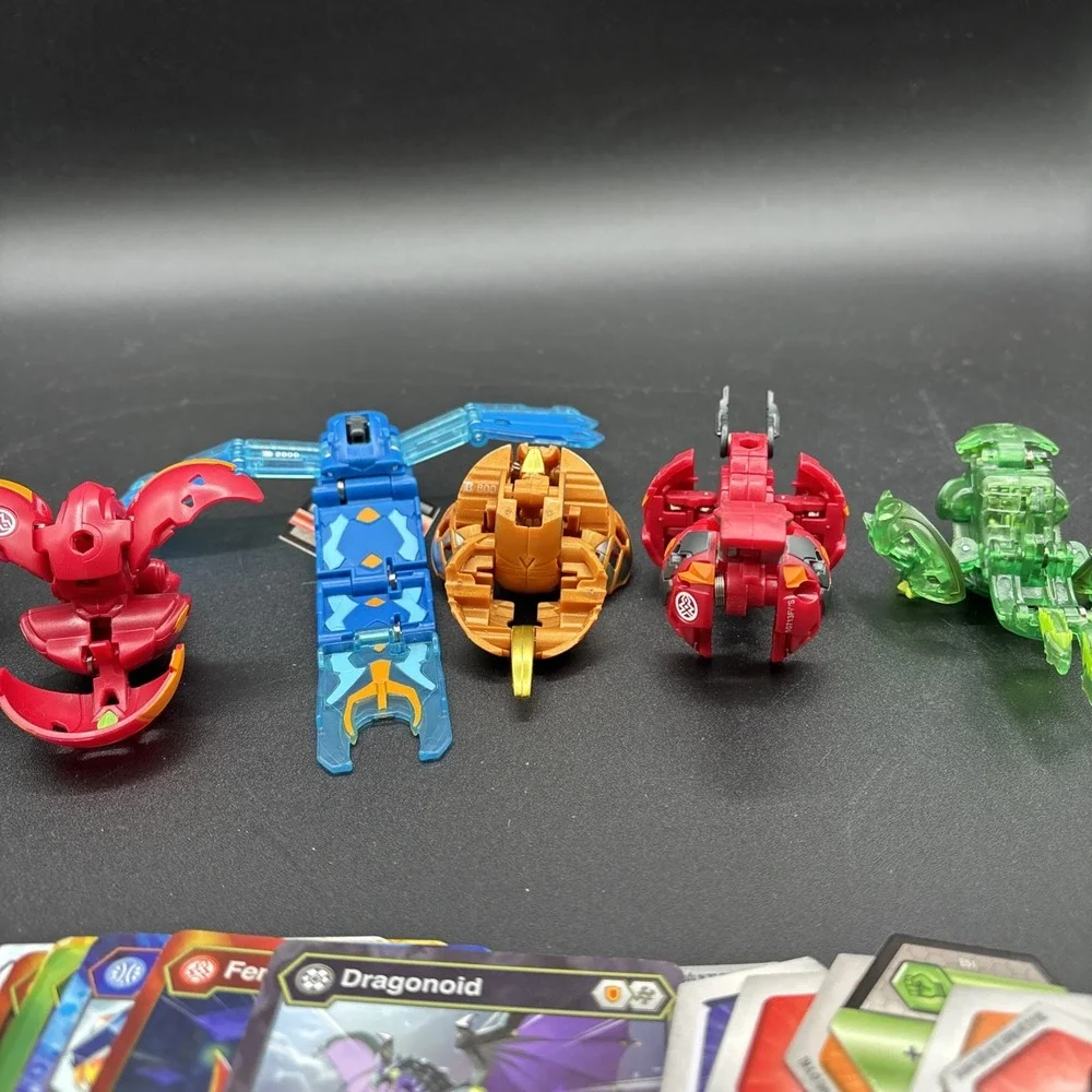 Lot Of 9 Bakugan Figures And 23 Bakugan Cards/Metal Card